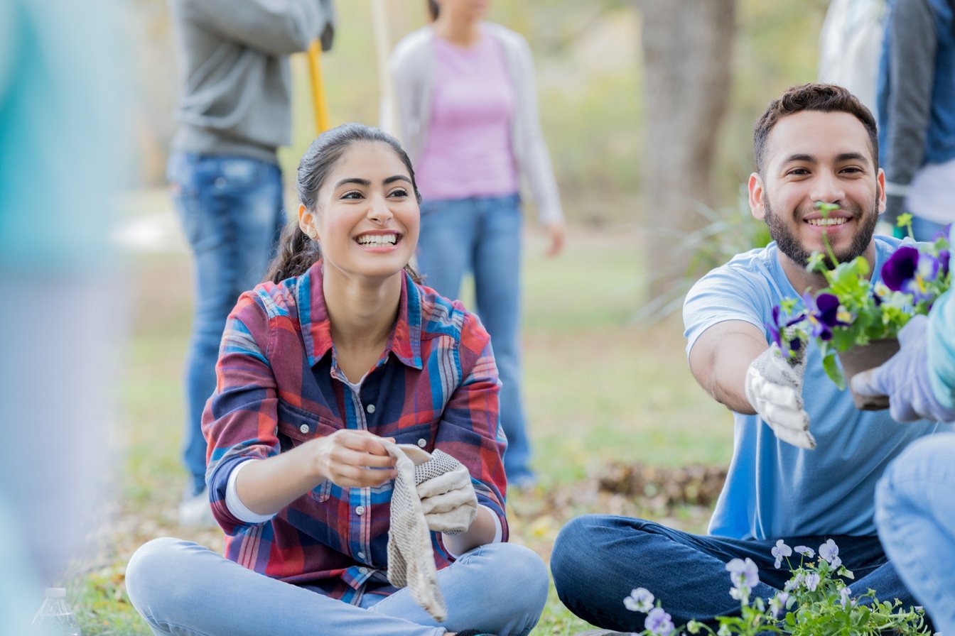 Young adults participate in community beautification event